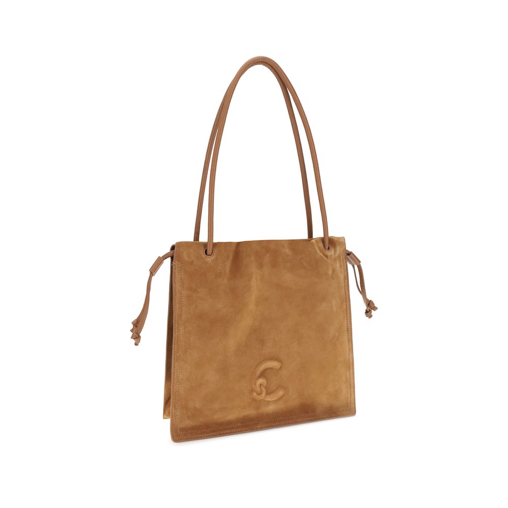 Stylish women’s beige leather handbag with spacious interior