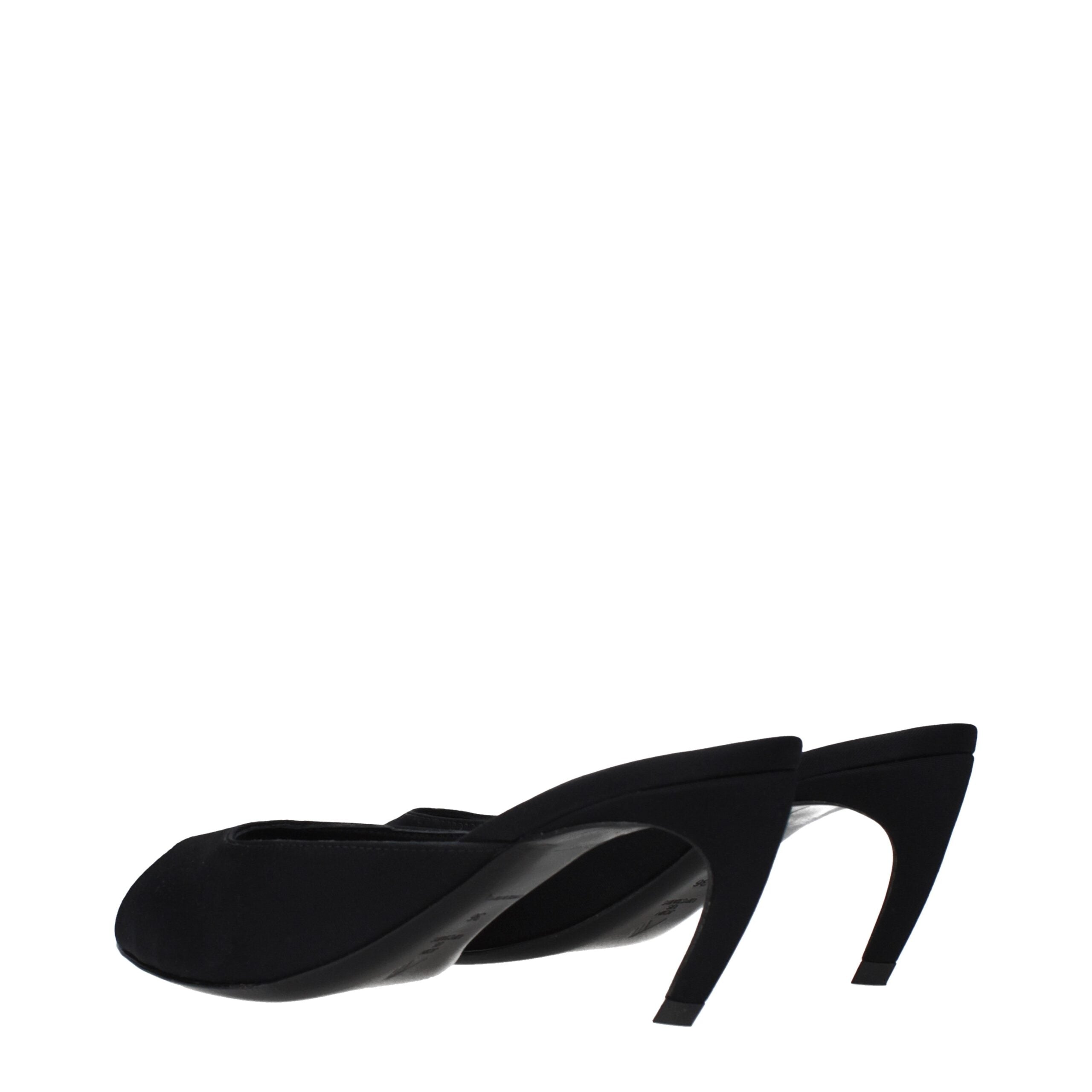 Model wearing black fabric flat sandals by KILAUE
