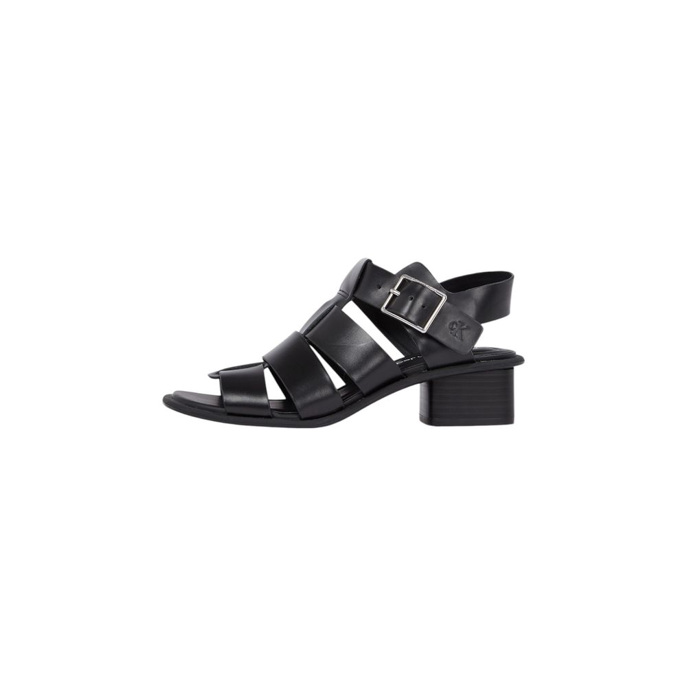Calvin Klein black MG buckle flat sandals side view 
