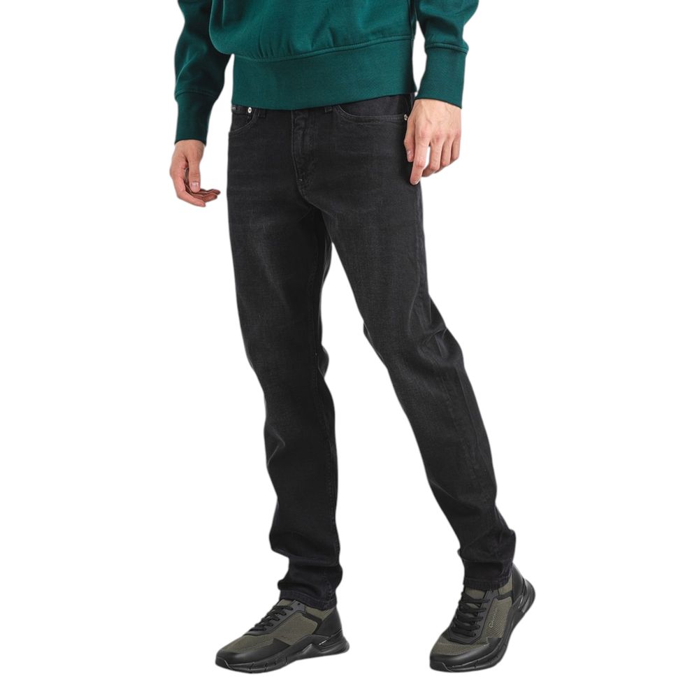 Calvin Klein black slim taper jeans men back view