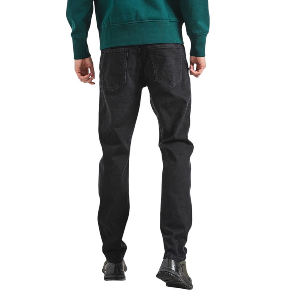 Calvin Klein black slim taper jeans men side view