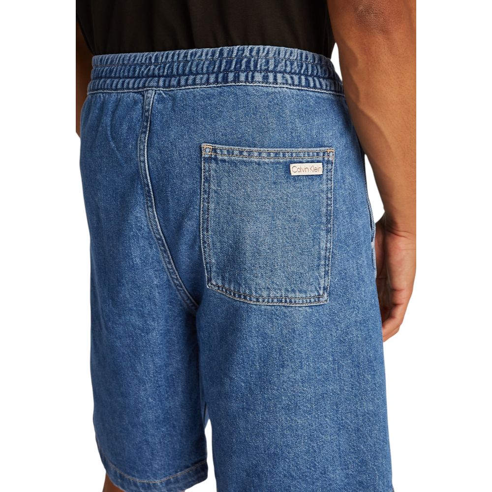 Flat lay image of Calvin Klein mens blue Bermuda shorts, classic summer fit