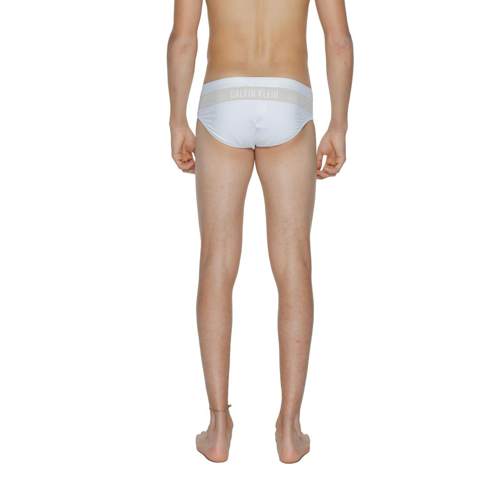 Calvin Klein men’s white core logo swim briefs back view