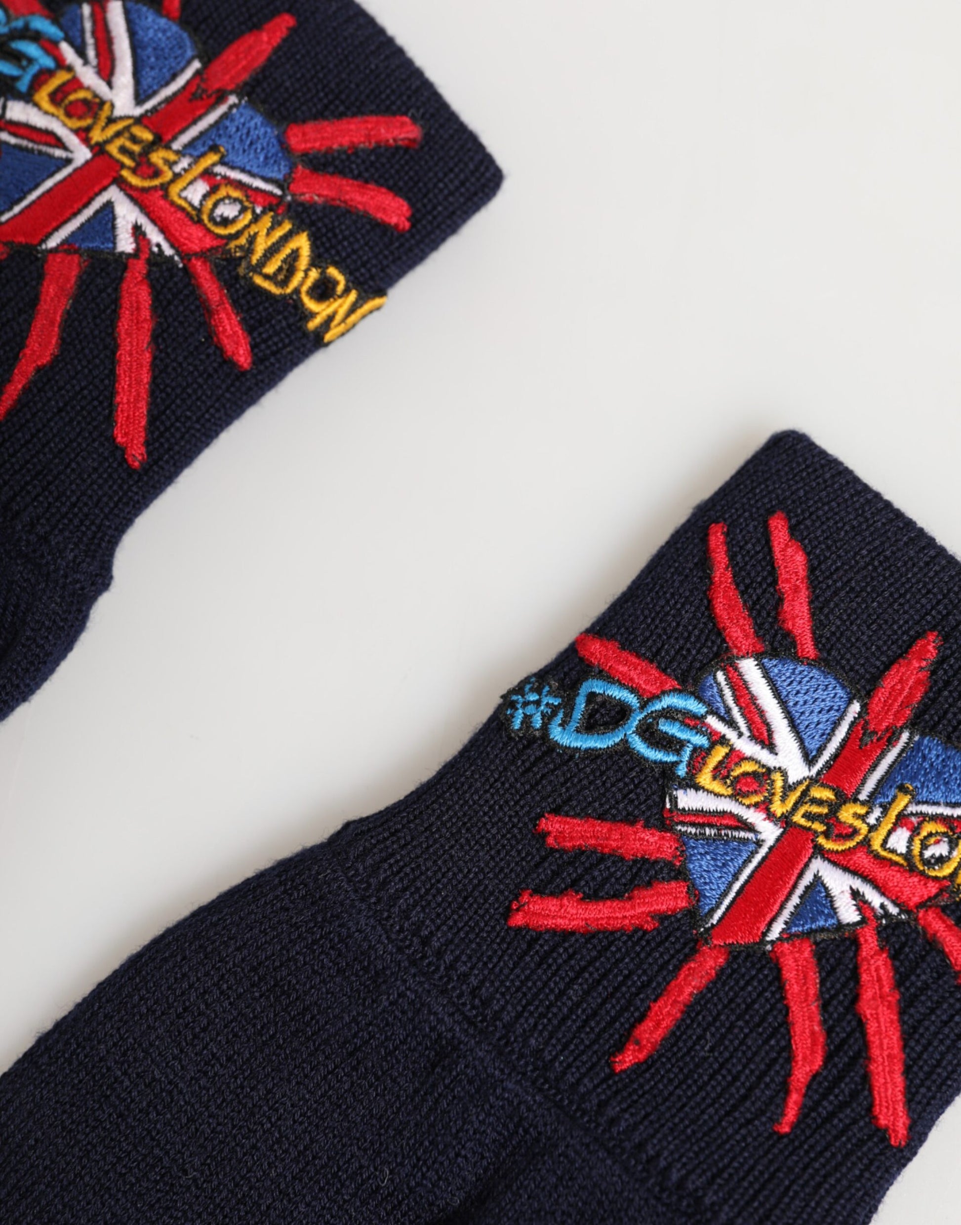 Back view of Dolce & Gabbana blue wool embroidered mitten gloves by KILAUE
