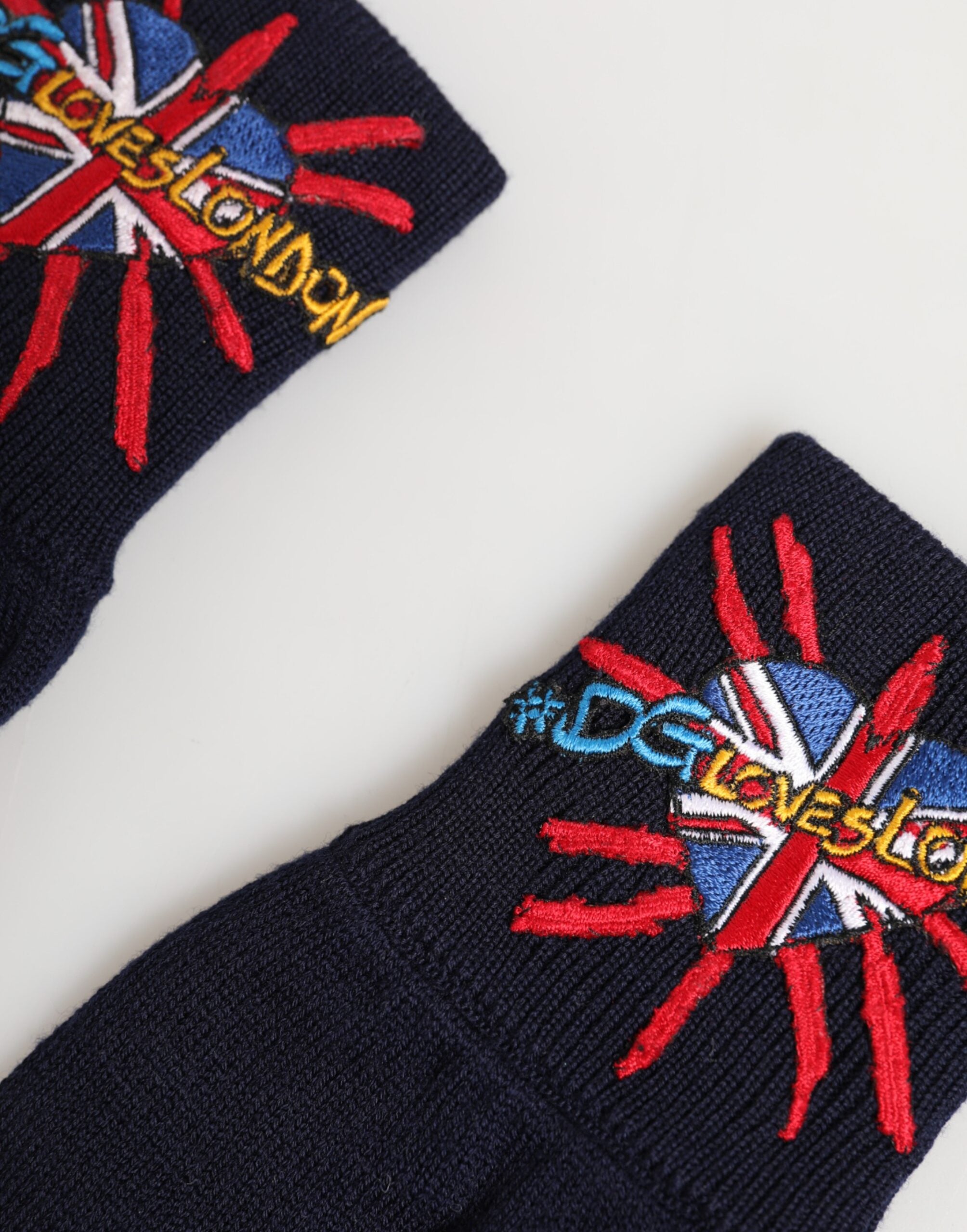 Back view of Dolce & Gabbana blue wool embroidered mitten gloves by KILAUE
