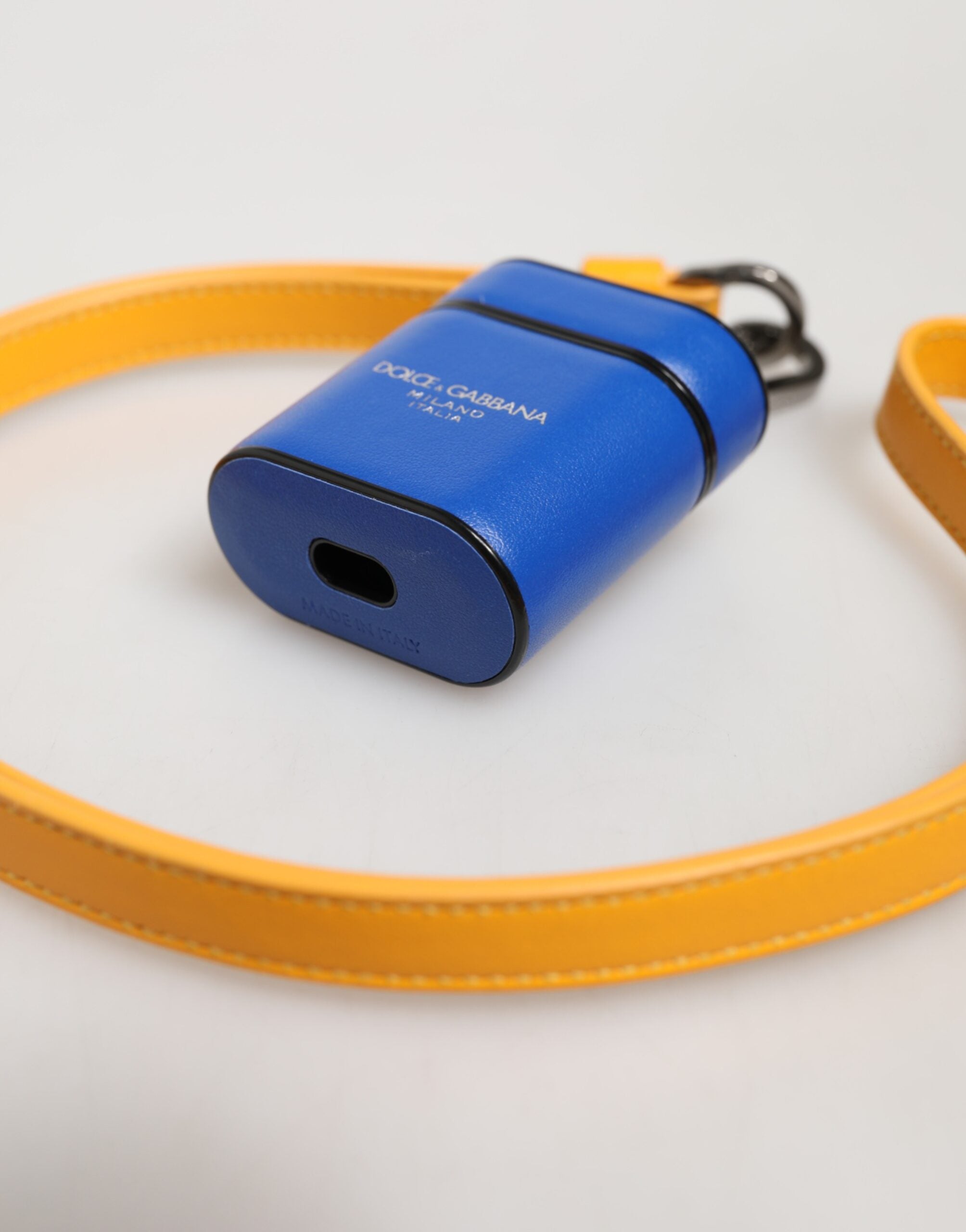 Model using Dolce & Gabbana blue and yellow calfskin AirPods case by KILAUE
