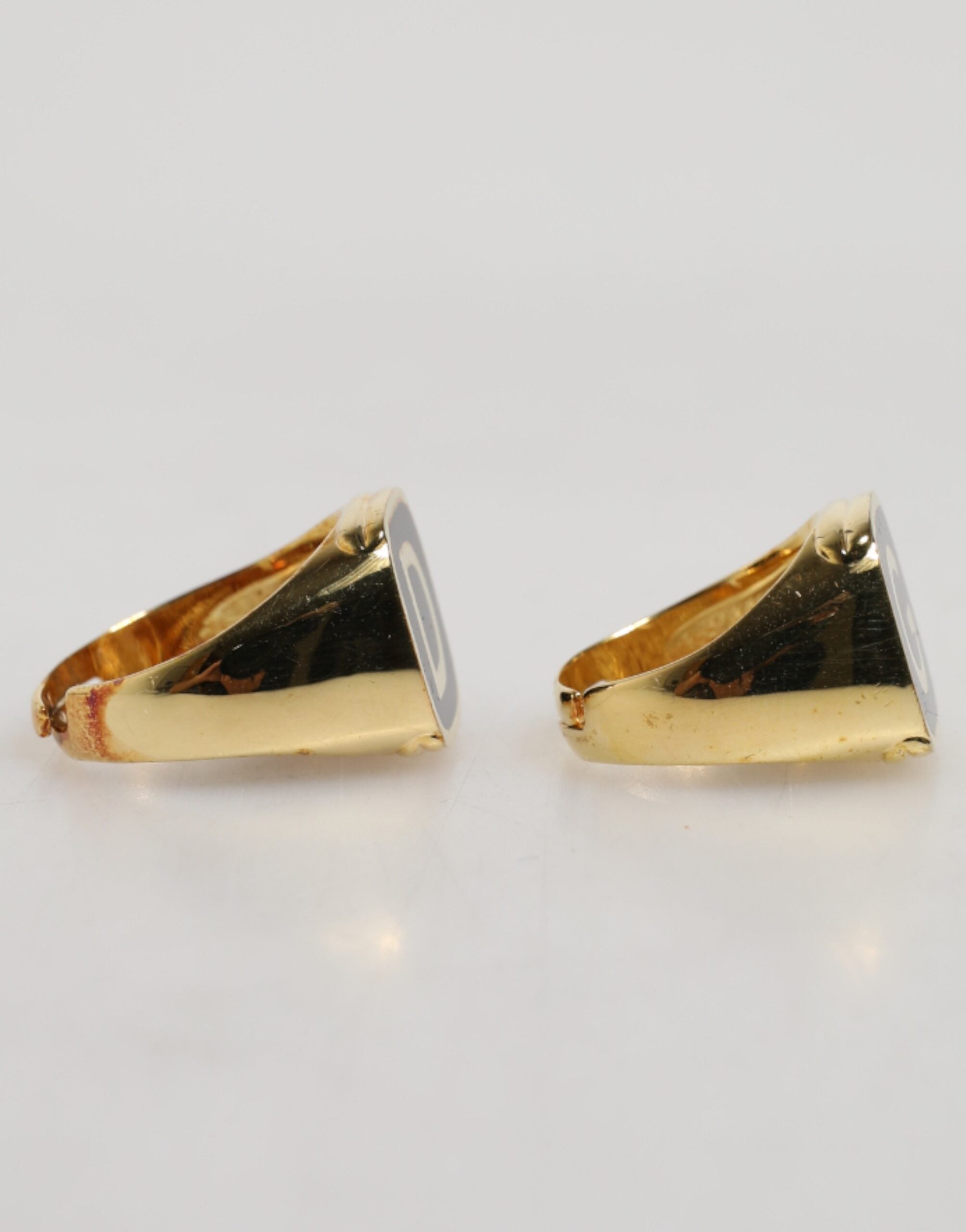 Back view of Dolce & Gabbana gold-tone brass black enamel logo adjustable ring by KILAUE
