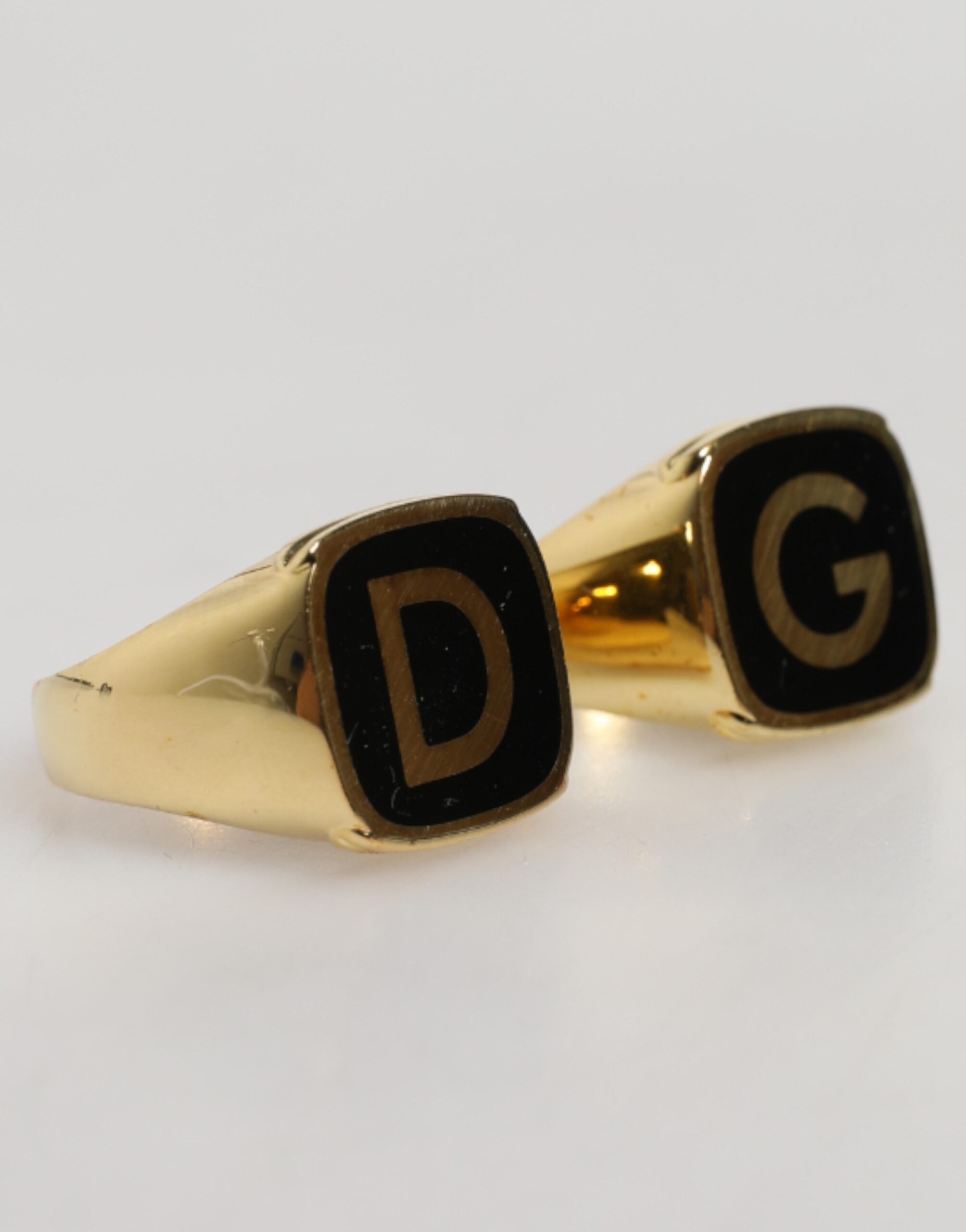 Front view of Dolce & Gabbana gold-tone brass black enamel