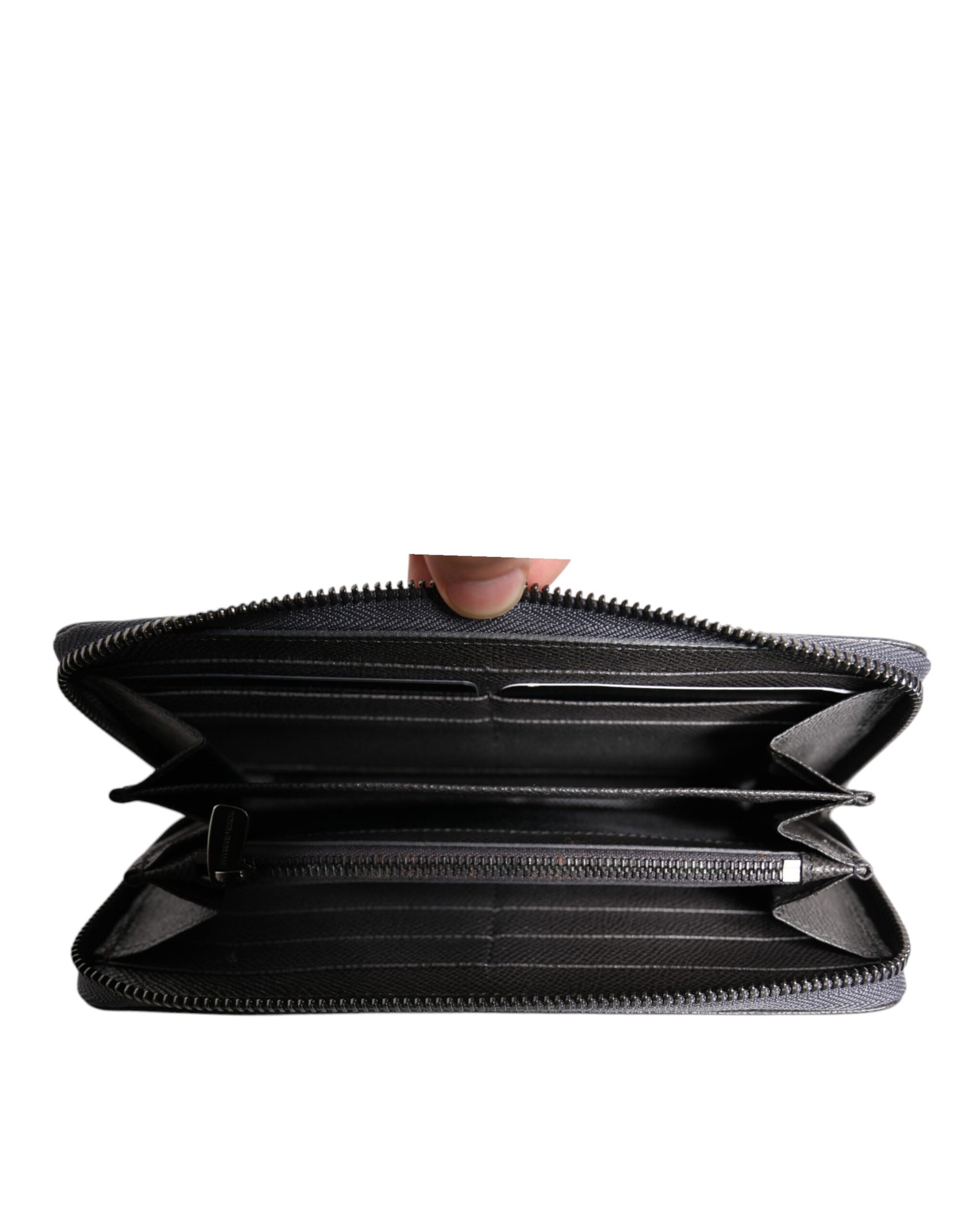 Close-up detail of Dolce & Gabbana dark gray leather DG logo and zipper hardware