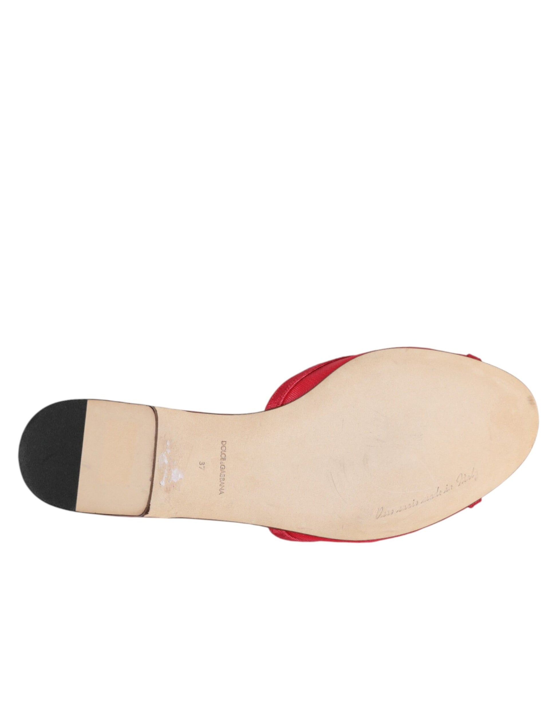 Close-up detail of Dolce & Gabbana red embellished slip-on flats by KILAUE
