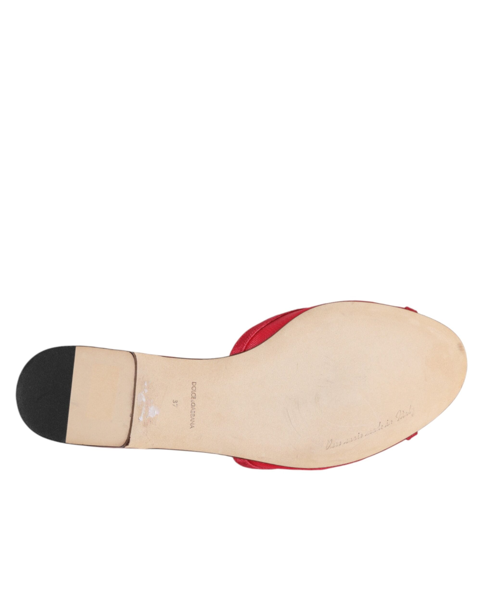 Close-up detail of Dolce & Gabbana red embellished slip-on flats by KILAUE
