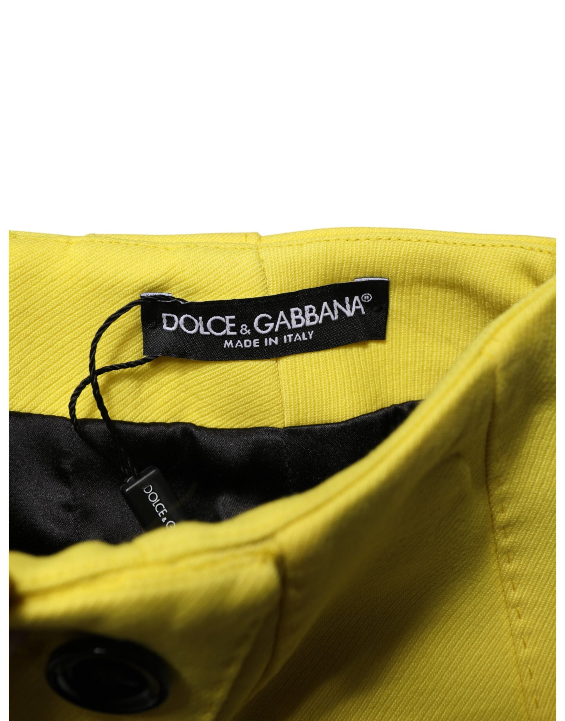 Close‑up detail of Dolce & Gabbana yellow virgin wool mini skirt buttons by KILAUE
