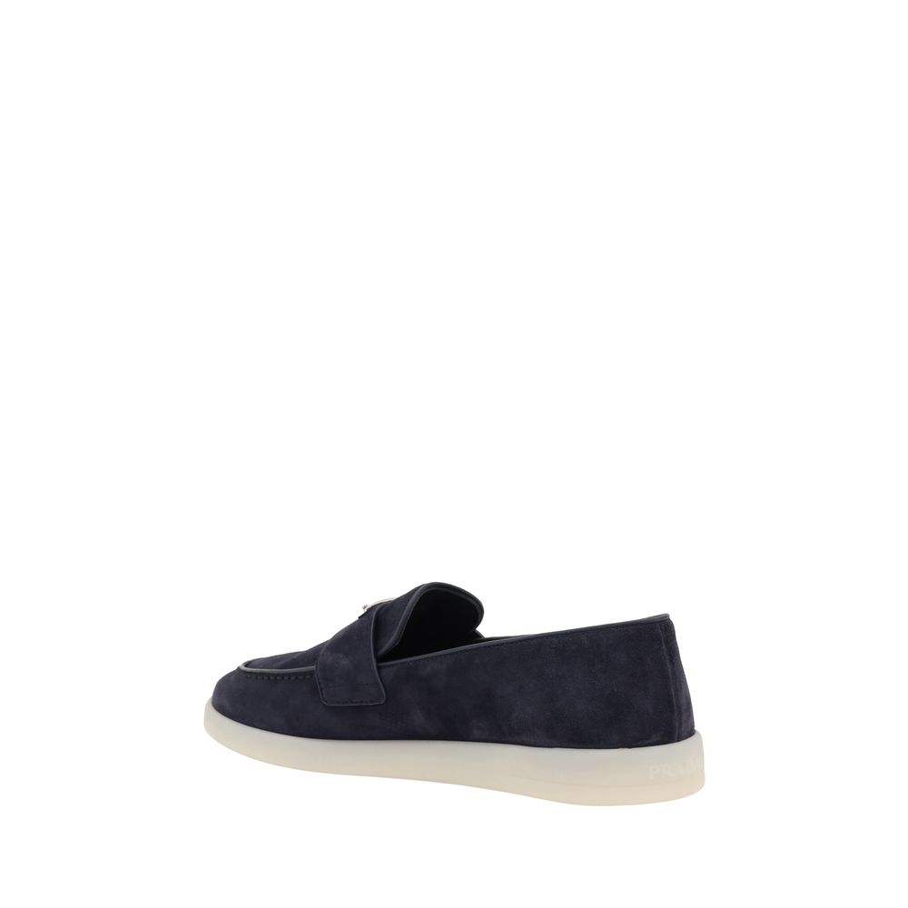 Back view of Prada blue suede slip-on loafers