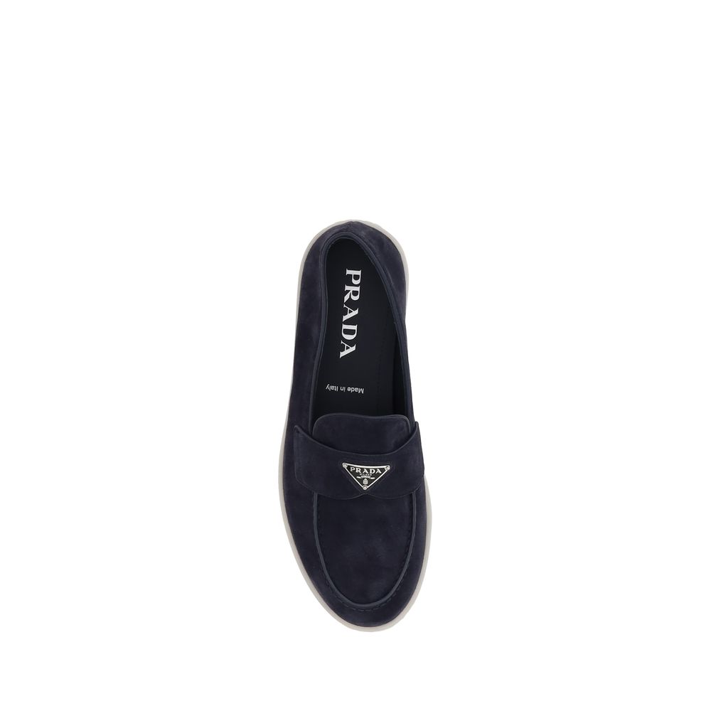 Detail of Prada blue suede slip-on loafers