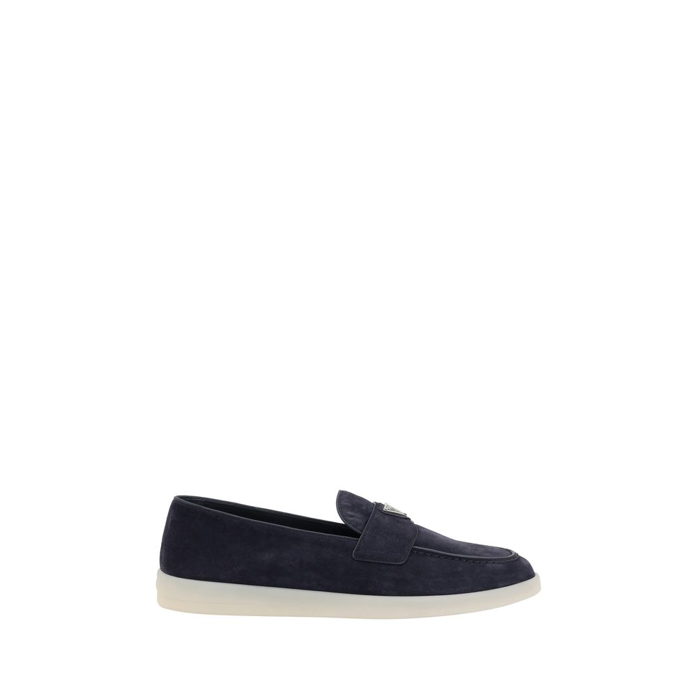 Front view of Prada blue suede slip-on loafers