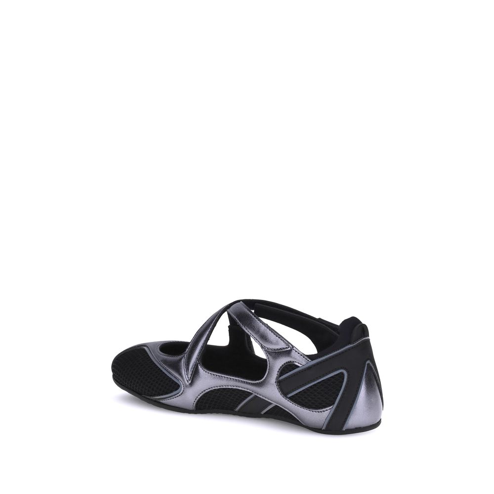 Back view of The Attico Black Nomad mesh ballet flats showing heel and strap details